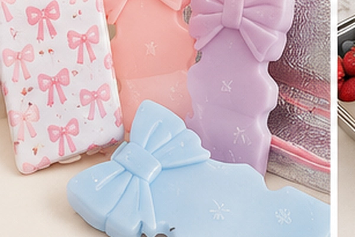 Reusable slim and flexible ice packs arranged beside a kids school lunch box