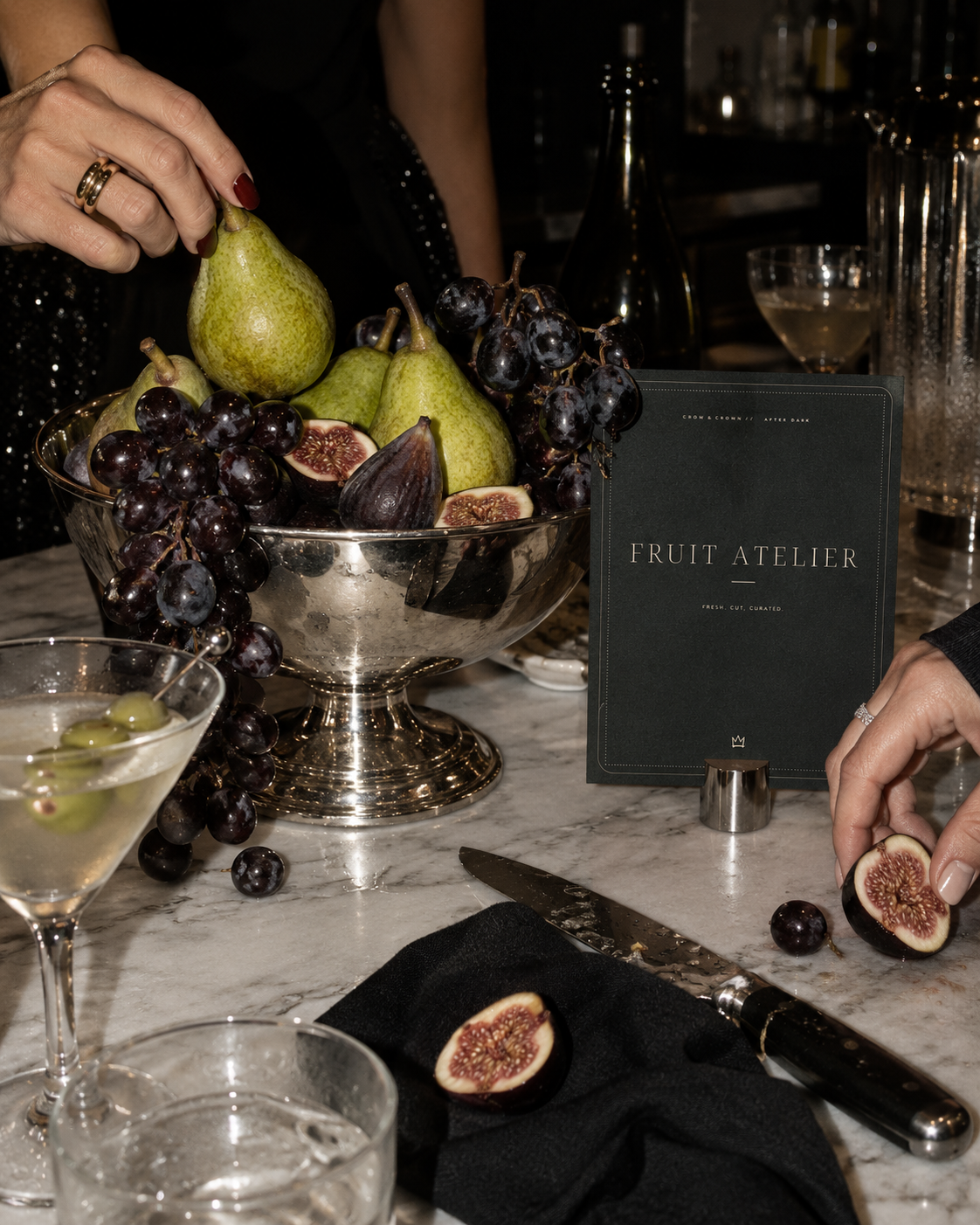 Fruit Atelier party printable sign with pears, figs and dark grapes on silver serveware