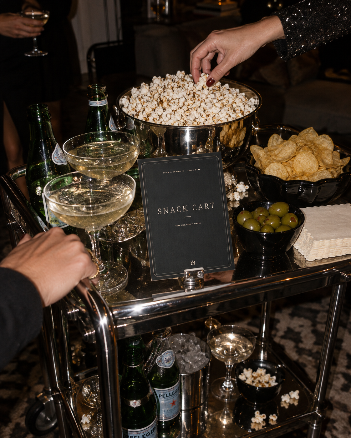 Snack Cart printable party sign on a chrome trolley with popcorn, chips and drinks