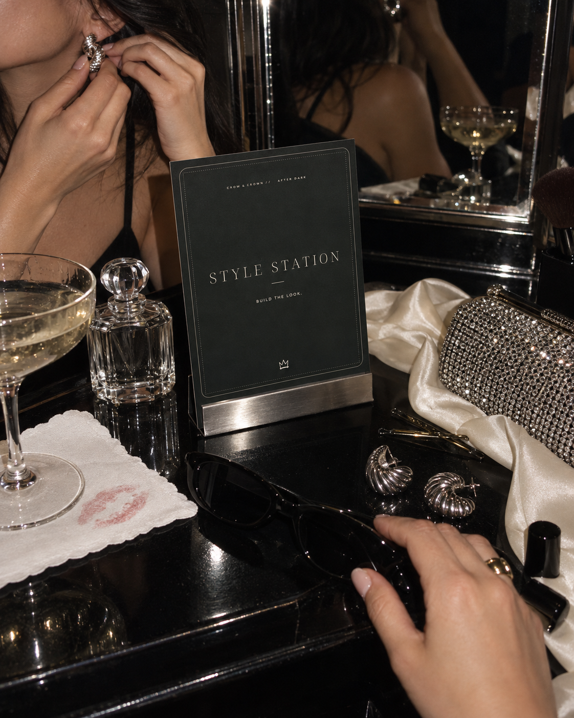 Style Station printable party sign beside jewelry and an evening clutch