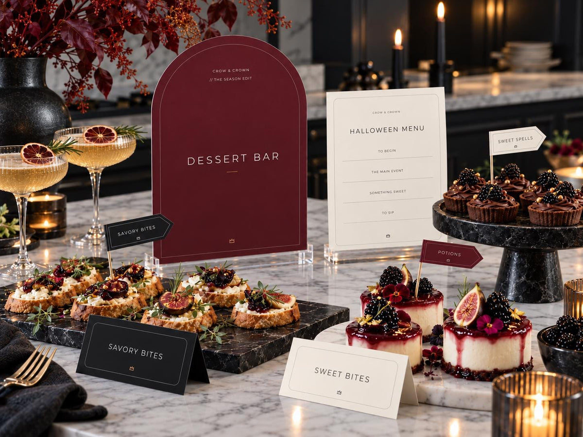 Dessert Bar Halloween printable and ivory menu beside cupcakes, berry desserts and food labels