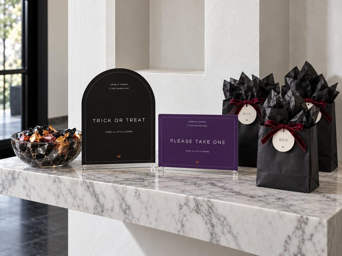 Trick or Treat and purple Please Take One Halloween signs with tagged black favor bags