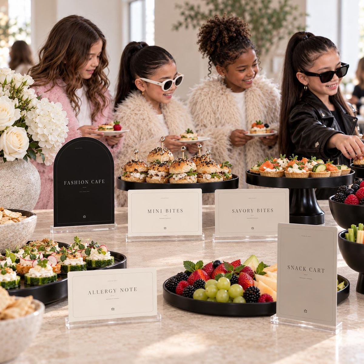 Fashion birthday buffet with a Fashion Cafe sign, Mini Bites cards and a Snack Cart printable