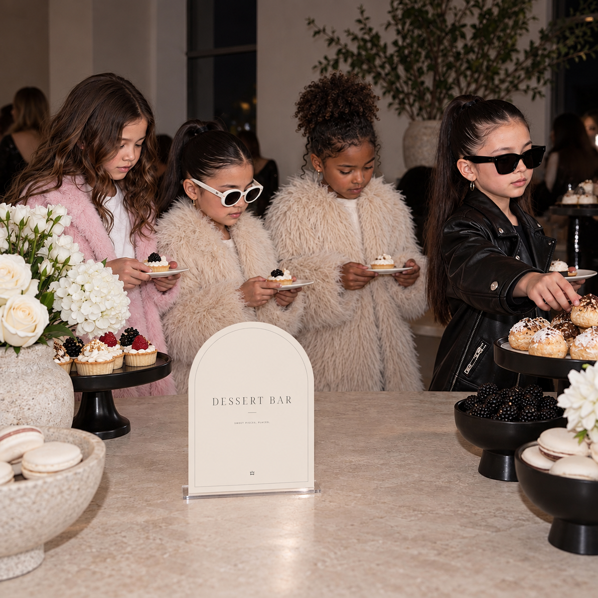 Dessert Bar fashion birthday sign beside a buffet of pastries and small cakes
