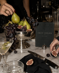 Fruit Atelier party printable sign with pears, figs and dark grapes on silver serveware