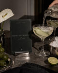 Mocktail Moment printable party sign beside a lime drink being poured into a coupe glass