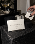 Please Take One printable favor sign with ivory boxes tied in black ribbon