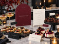 Dessert Bar Halloween printable and ivory menu beside cupcakes, berry desserts and food labels