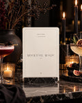 Mocktail Magic Halloween printable between two drinks on dark veined marble