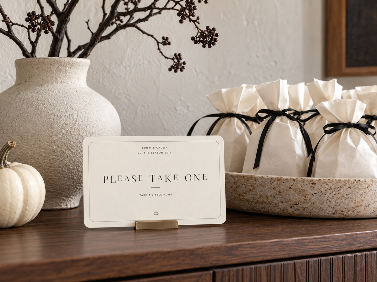 Please Take One Halloween printable in front of white favor bags tied with black ribbon