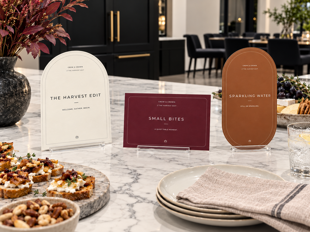 The Harvest Edit welcome printable with a wine Small Bites card and Sparkling Water sign at a buffet