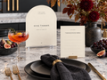Ivory Give Thanks and Thanksgiving Menu printables behind a black place setting