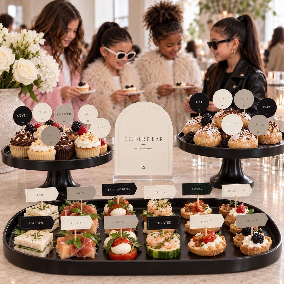 Minimal Fashion birthday dessert table with Dessert Bar sign, food cards, round toppers and guests