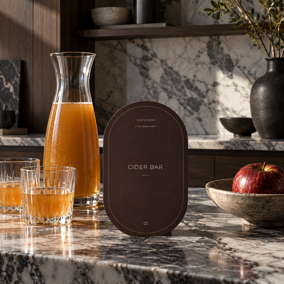 Cider Bar Thanksgiving printable beside a glass carafe and apple cider