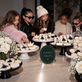 Runway Treats fashion birthday sign with fashion-themed cookies on cake stands