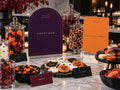 Purple Candy Bar and orange Mocktail Magic Halloween signs with jars of candy and decorated cookies