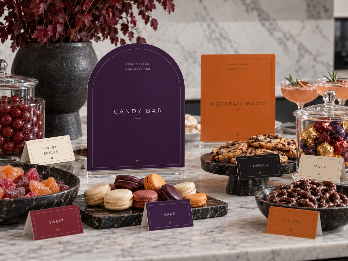 Candy Bar and Mocktail Magic Halloween printables beside candy jars, macarons and pretzels