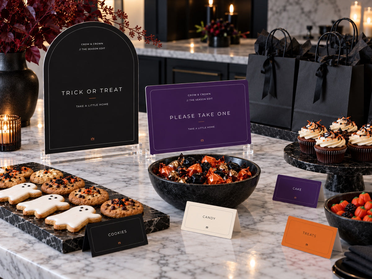 Trick or Treat and Please Take One Halloween signs with black favor bags and cookie trays