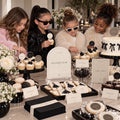 Minimal Fashion dessert display with an arched Dessert Bar sign, round toppers and mini food labels
